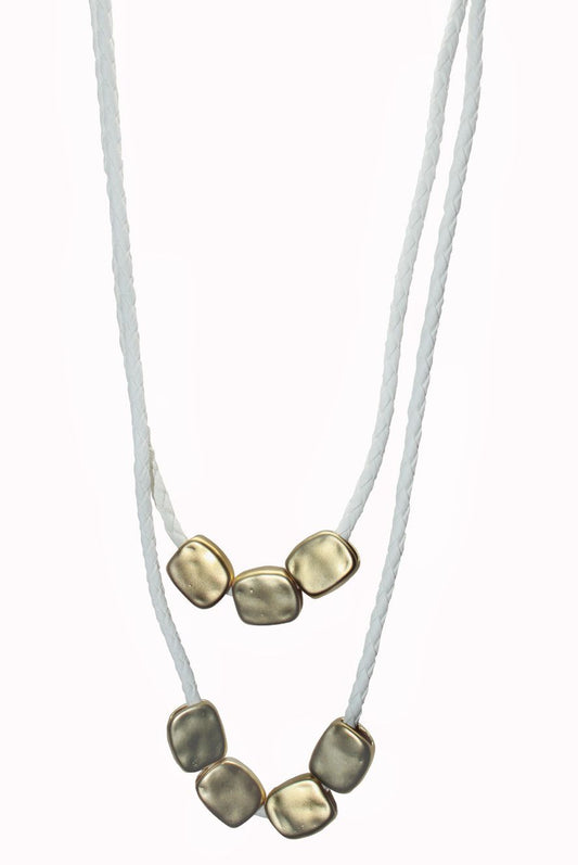 Matt gold n&#039;klace white cord